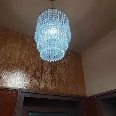 a chandelier hanging from a ceiling in a room at INSTA Haus in Plovdiv