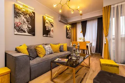 a living room with a couch and a table at Apollo Apartment close to Medical University in Plovdiv