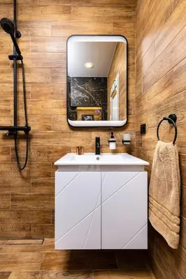 a bathroom with a white sink and a mirror at Apollo Apartment close to Medical University in Plovdiv
