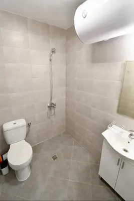 a bathroom with a toilet and a sink at Flower home 10 in Sofia