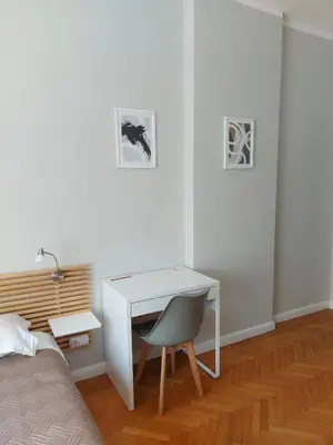 a white desk with a chair in a bedroom at Studio 72 in Sofia
