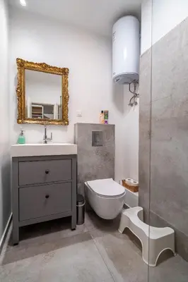 a bathroom with a sink and a toilet and a mirror at 1 Bedroom Natural Condo in Sofia