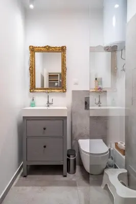 a bathroom with a sink and a toilet and a mirror at 1 Bedroom Natural Condo in Sofia
