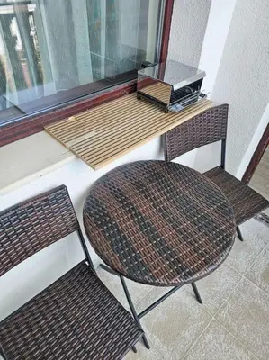 two chairs and a table in front of a window at Boutique Studio B37 in Borovets