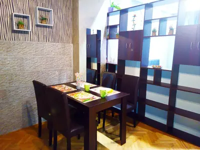 a dining room with a wooden table and chairs at 