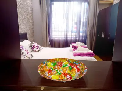 a room with a bowl of candy on a table at 