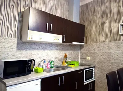 a kitchen with a sink and a microwave at 