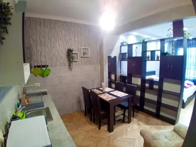 a kitchen with a table and a dining room at 