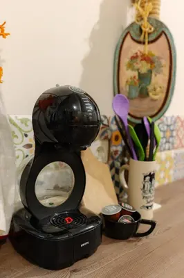 a camera sitting on top of a wooden table at Two Homelike Apartments by NDK and Vitosha Blvd with 2 Free Parking Spots in Sofia