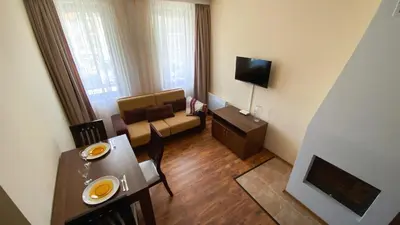 a room with a dining table and a living room at 