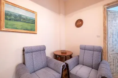two chairs and a table in a room at Urban Haven Retreat in Sofia