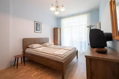 a bedroom with a bed and a tv in it at Urban Haven Retreat in Sofia