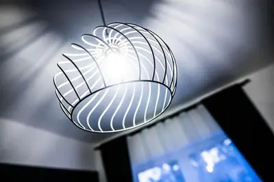 a light that is hanging from a ceiling at Green Flat Sofia Historic Center in Sofia