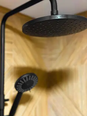 a black fan hanging on a wooden floor at 4 BDR 2 BTH Netflix Panorama Views in Sofia