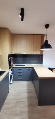 a kitchen with blue cabinets and a counter top at Sunflower in Sofia