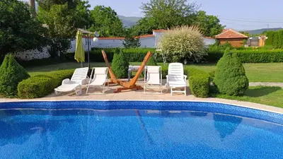 a group of chairs and a swimming pool at Vila Teo in Vasil Levski