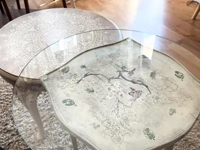 a table with a glass top on top of a chair at The Lemons Cozy Apartment in Sofia