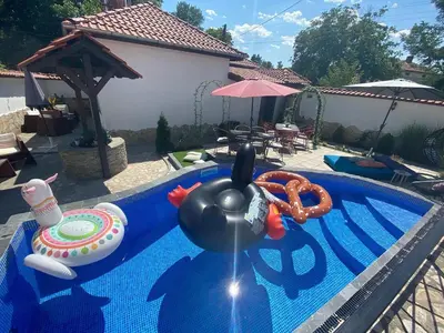 a swimming pool with a toy in the middle at Къща за гости Casa Per Te село Огняново - село Марчево in Marchevo