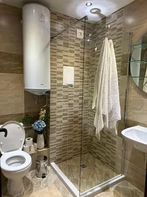 a bathroom with a shower and a toilet and a sink at CENTER Elegant Living in Sofia