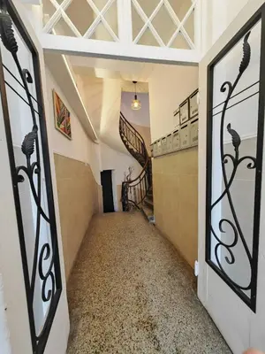 a hallway with a spiral staircase in a house at Central 1-BR Apartment in Sofia