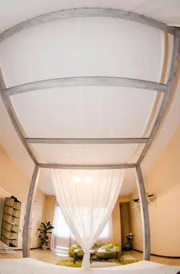 a room with a white ceiling with a window at 19 Cozy Central Apartment with Balcony in Sofia