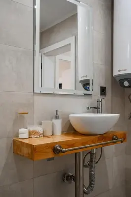 a bathroom with a sink and a mirror at 2-Bedroom Flat - Sunny Balcony in Plovdiv