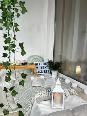 a room with a bed with a book and a lamp at Casa Rea - Comfortable Stay with Free Parking in Sofia