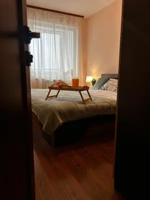 a bedroom with a bed with a table on it at Casa Rea - Comfortable Stay with Free Parking in Sofia