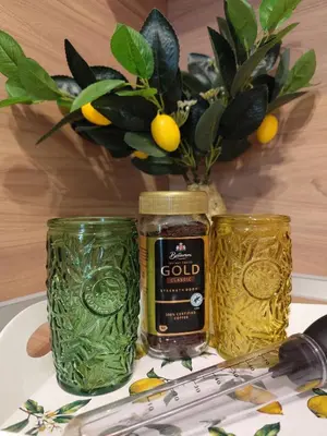 two jars of gold on a table with a vase at Sunny Hill Sandanski in Sandanski