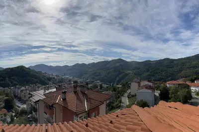 a view of a town with mountains in the background at Apartment Yana- The Amazing View in Smolyan