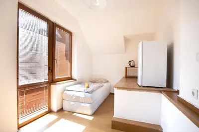 a kitchen with a white refrigerator in a room at Nova Guesthouse - Private En-Suite Rooms I Sofia Center I Self Check-In in Sofia