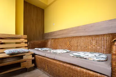 two beds in a room with yellow walls at Nova Guesthouse - Private En-Suite Rooms I Sofia Center I Self Check-In in Sofia