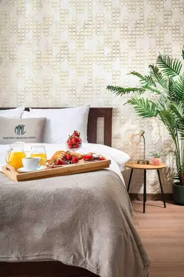 a tray of fruit on a bed in a bedroom at Spacious and relaxing in Sofia