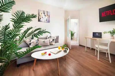 a living room with a couch and a table at Spacious and relaxing in Sofia
