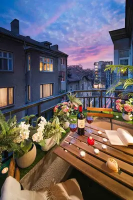 a bottle of wine sitting on a table on a balcony at Spacious and relaxing in Sofia