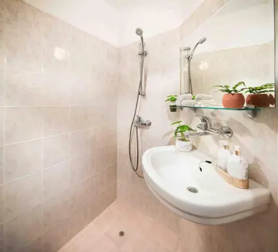 a bathroom with a sink and a shower at Spacious and relaxing in Sofia