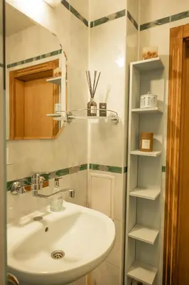 a bathroom with a sink and a mirror at ArtE Vitosha Blvd in Sofia