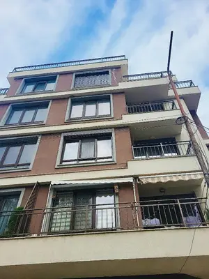 a tall building with balconies and a fire escape at Luxury apartment in Teteven
