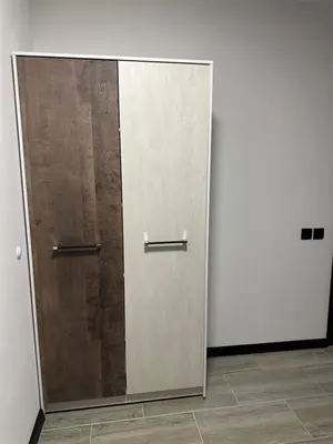 a pair of doors in a room with a mirror at MonarX Suites in Bansko