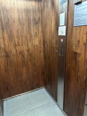 a wooden door with a sign on it at MonarX Suites in Bansko