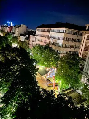 a city at night with trees and buildings at Main Street Sunshine 2 KING Bdr in Sofia