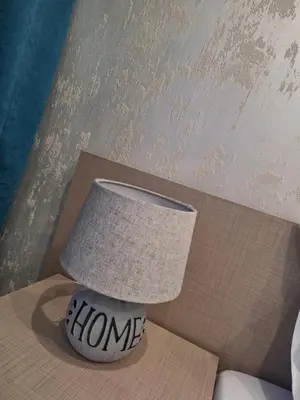 a lamp on a table with the words home on it at Sandanski park view in Sandanski