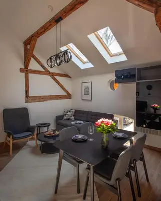 a living room with a table and a couch at Ruby Red House in Sofia