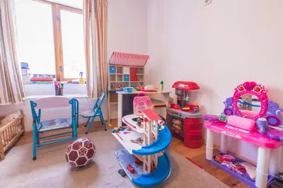 a room filled with lots of play furniture and toys at Stone house (Каменната къща) in Leshten