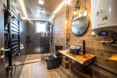 a bathroom with a sink and a mirror at Apartment Tiana Lux 2 in Hisarya