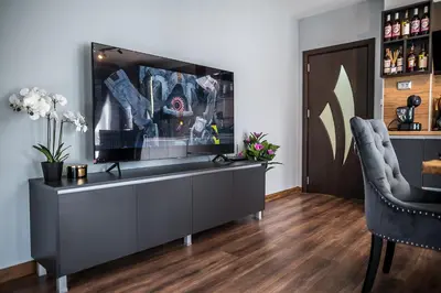 a living room with a television on a dresser at Apartment Tiana Lux 2 in Hisarya