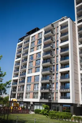 a tall apartment building with balconies on it at ТОП Апартаменти в Панорама Парк in Plovdiv