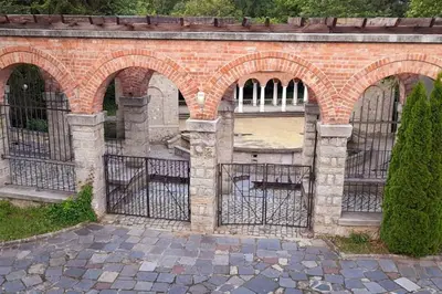 a brick building with arches on the side of it at Luxury Apartment two bedrooms Paul Sеzanne in Hisarya