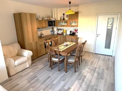 a kitchen and dining room with a table and chairs at VANITY Apartments in Sandanski
