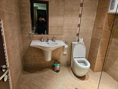 a bathroom with a sink and a toilet at TERRA COMPLEX D5 - Private apartment - Golf, Skiing & SPA in Razlog